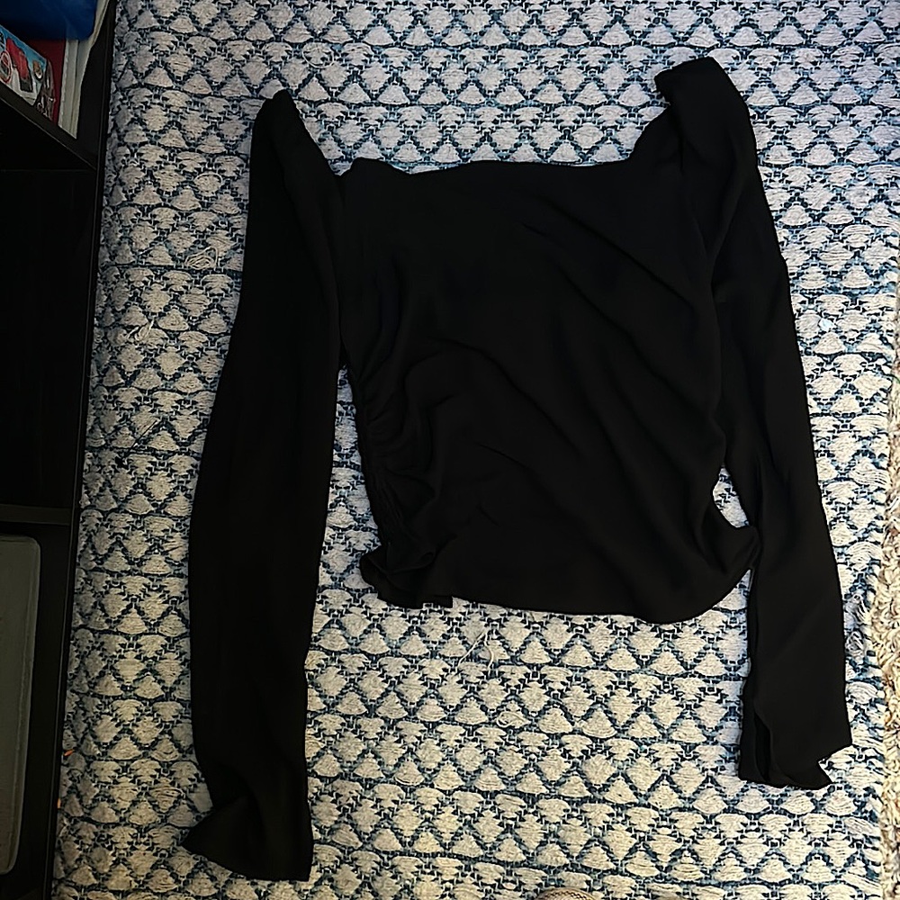 Black long sleeve blouse, ruched back, and a slit sleeve.